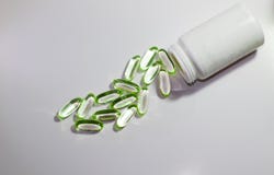 vistraantabletten geïsoleerde pillen stock afbeelding vistraantabletten geïsoleerde pillen stock afbeelding