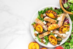 Vitamin Salad With Grilled Chicken And Peach, Feta Cheese And Walnuts In A Plate. Healthy Food. Top View Stock Photography Vitamin Salad With Grilled Chicken And Peach, Feta Cheese And Walnuts In A Plate. Healthy Food. Top View Stock Photography