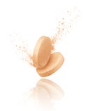 Vitamins pills collide and fall down on white background Stock Photography Vitamins pills collide and fall down on white background Stock Photography