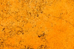 Vivid bright orange color facade stone wall with imperfections and cracks as empty rustic and simple background stock image Vivid bright orange color facade stone wall with imperfections and cracks as empty rustic and simple background stock image