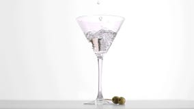 Vodka martini filling in super slow motion a glass