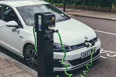 Volkswagen Golf GTE charging at a charging point on a street in London