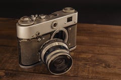 Voronezh Russia 02 april 2019 old vintage soviet camera with lens on wooden background royalty free stock photography Voronezh Russia 02 april 2019 old vintage soviet camera with lens on wooden background royalty free stock photography