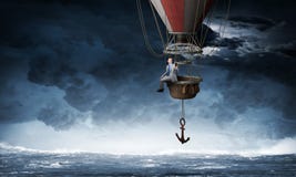 Voyage d'homme d'affaires sur le ballon à air image stock Voyage d'homme d'affaires sur le ballon à air image stock