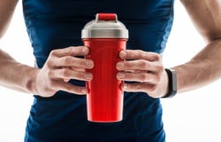 Vrolijke jonge mannelijke atleet met verse drank stock afbeelding Vrolijke jonge mannelijke atleet met verse drank stock afbeelding