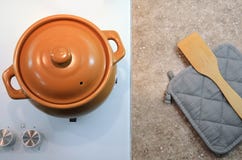 Vue supérieure d'un pot, d'un potholder et d'une spatule en céramique Configuration plate image image libre de droits Vue supérieure d'un pot, d'un potholder et d'une spatule en céramique Configuration plate image image libre de droits