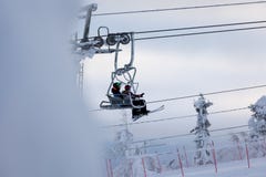 Man a a girl in ski lift in Vuokatinrinteet Ski Resort