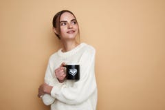 Waist up of pretty lady enjoying hot tea and smiling stock image Waist up of pretty lady enjoying hot tea and smiling stock image