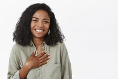 Waist-up shot of amused attractive and stylish young african american female with curly haircut being pleased receiving stock image Waist-up shot of amused attractive and stylish young african american female with curly haircut being pleased receiving stock image