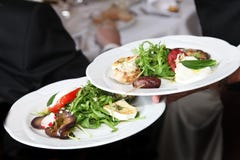 Waiter Carrying Plates Of Starters Stock Image Waiter Carrying Plates Of Starters Stock Image