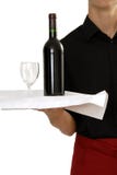 Waiter carrying wine