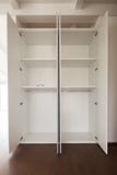 White wardrobe with open spaces royalty free stock photos White wardrobe with open spaces royalty free stock photos