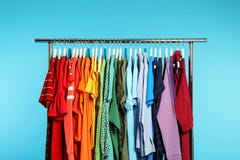 Wardrobe Rack With Different Bright Clothes Stock Photo