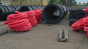 Warehouse of finished plastic pipes industrial outdoors storage site. Manufacture of plastic water pipes factory. royalty free stock photo Warehouse of finished plastic pipes industrial outdoors storage site. Manufacture of plastic water pipes factory. royalty free stock photo