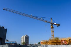 Warehouse tower cranes and construction equipment royalty free stock photo Warehouse tower cranes and construction equipment royalty free stock photo
