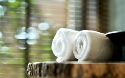 Warm Atmosphere In Spa Resort, Close Up Of Spa Essentials And Towels On Wooden Tray In Bathroom, Essential Oil. Royalty Free Stock Images Warm Atmosphere In Spa Resort, Close Up Of Spa Essentials And Towels On Wooden Tray In Bathroom, Essential Oil. Royalty Free Stock Images