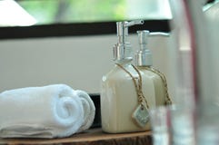 Warm Atmosphere In Spa Resort, Close Up Of Spa Essentials And Towels On Wooden Tray In Bathroom, Essential Oil. Stock Images Warm Atmosphere In Spa Resort, Close Up Of Spa Essentials And Towels On Wooden Tray In Bathroom, Essential Oil. Stock Images