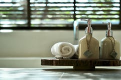 Warm Atmosphere In Spa Resort, Close Up Of Spa Essentials And Towels On Wooden Tray In Bathroom, Essential Oil. Stock Images Warm Atmosphere In Spa Resort, Close Up Of Spa Essentials And Towels On Wooden Tray In Bathroom, Essential Oil. Stock Images
