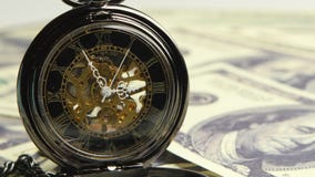Watch skeleton on a background of money. Close up. Watch skeleton on a background of money, minute, mechanical watch, antiques pocket watches, watches are on one Watch skeleton on a background of money. Close up. Watch skeleton on a background of money, minute, mechanical watch, antiques pocket watches, watches are on one