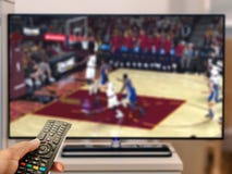 Watching basketball game on TV royalty free stock photos Watching basketball game on TV royalty free stock photos