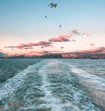 Watching Manhattan disappear on the Staten Island Ferry stock photography Watching Manhattan disappear on the Staten Island Ferry stock photography