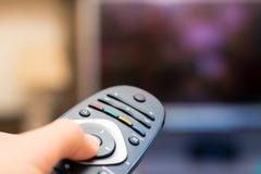 Watching TV and pressing remote controller in first person views royalty free stock photo Watching TV and pressing remote controller in first person views royalty free stock photo