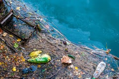 Water pollution old garbage and oil patches on water surface Royalty Free Stock Photos Water pollution old garbage and oil patches on water surface Royalty Free Stock Photos