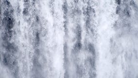 Waterfall close up slow motion background, Skogafoss Iceland. Abstract water background. Shot of real water texture for stock footage Waterfall close up slow motion background, Skogafoss Iceland. Abstract water background. Shot of real water texture for stock footage