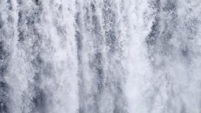 Waterfall close up slow motion background, Skogafoss Iceland. Abstract water background. Shot of real water texture for stock video footage Waterfall close up slow motion background, Skogafoss Iceland. Abstract water background. Shot of real water texture for stock video footage