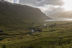 Waterfalls blown dramatically upwards by a heavy storm making them look like steam pipes, at the Faroe Islands. stock image Waterfalls blown dramatically upwards by a heavy storm making them look like steam pipes, at the Faroe Islands. stock image