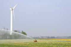 Modern wind turbine delivers renewable alternative energy to sprinkle the Noordoostpolder, Flevoland, Netherlands