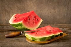 Watermelon slices on the woodan table. Fresh red watermelon. Rus Stock Photo Watermelon slices on the woodan table. Fresh red watermelon. Rus Stock Photo