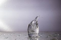 Wave with splashes in a glass stock photography Wave with splashes in a glass stock photography