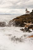 Waves Crash onto Sharp Rocks Jetty San Juan Island Lighthouse royalty free stock image Waves Crash onto Sharp Rocks Jetty San Juan Island Lighthouse royalty free stock image