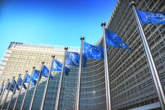 Waving EU flags in front of European Commission in Brussels stock images Waving EU flags in front of European Commission in Brussels stock images