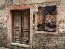 Weathered old door and shutters of a stone house in Cres royalty free stock photo Weathered old door and shutters of a stone house in Cres royalty free stock photo