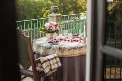 Romantic decor of the festive table in the restaurant with candles, flowers, rose petals royalty free stock images Romantic decor of the festive table in the restaurant with candles, flowers, rose petals royalty free stock images