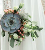 Wedding bouquet, exclusive, rich design Bride holding the wedding bouquet, close-up royalty free stock images Wedding bouquet, exclusive, rich design Bride holding the wedding bouquet, close-up royalty free stock images