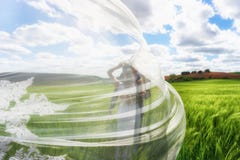 Wedding couple covered with a large beautiful embroidered veil royalty free stock images Wedding couple covered with a large beautiful embroidered veil royalty free stock images