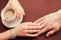 Wedding couple hands and coffee cup close-up royalty free stock photography Wedding couple hands and coffee cup close-up royalty free stock photography