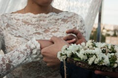 Wedding day. The groom places the ring on the bride`s hand. Photo closeup stock image Wedding day. The groom places the ring on the bride`s hand. Photo closeup stock image