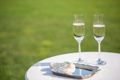 Wedding rings and glasses of champagne stock photo Wedding rings and glasses of champagne stock photo