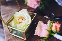 Wedding Rings In The Box And A Bouquet Of The Bride On The Table. Royalty Free Stock Images