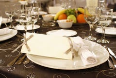 Wedding table arrangement with blank invitation