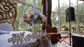 Wedding table at a wedding feast decorated with bridal bouquet. Banquet hall. festive table for the bride and groom stock images Wedding table at a wedding feast decorated with bridal bouquet. Banquet hall. festive table for the bride and groom stock images