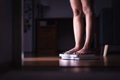 Weight loss and diet concept. Lady standing on scale. Woman weighing herself. Fitness lady dieting. Weightloss and dietetics. royalty free stock photo Weight loss and diet concept. Lady standing on scale. Woman weighing herself. Fitness lady dieting. Weightloss and dietetics. royalty free stock photo