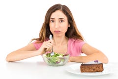 Weight loss woman eating salad wishing for a piece of cake stock images Weight loss woman eating salad wishing for a piece of cake stock images