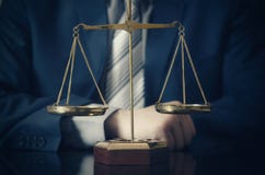 Weight scale of justice, lawyer in background Royalty Free Stock Photography Weight scale of justice, lawyer in background Royalty Free Stock Photography