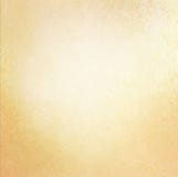 Weinlesealter Papierhintergrund mit weicher Goldfarbe und verkratzter Beschaffenheit Weinlesealter Papierhintergrund mit weicher Goldfarbe und verkratzter Beschaffenheit
