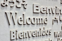 Welcome board with greeting on foreign languages